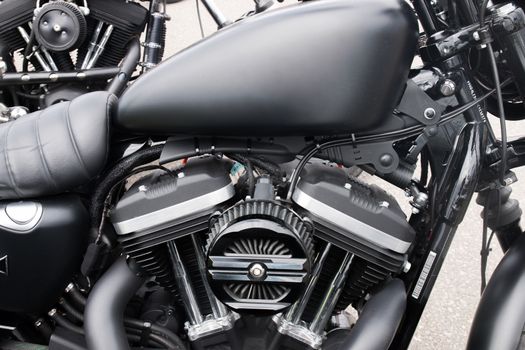 Close view detail of the shiny details of a classic motorcycle.