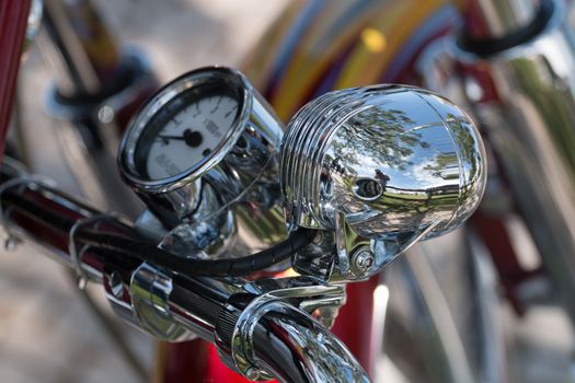 Close view detail of the shiny details of a classic motorcycle.