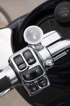 Close view detail of the shiny details of a classic motorcycle.