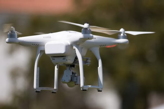 View of a small consumer quadrocopter drone in flight.