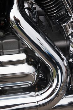 Close view detail of the shiny details of a classic motorcycle.