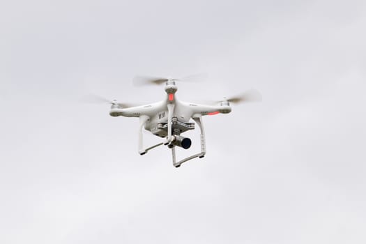 View of a small consumer quadrocopter drone in flight.