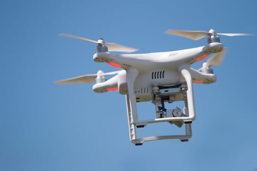 View of a small consumer quadrocopter drone in flight.