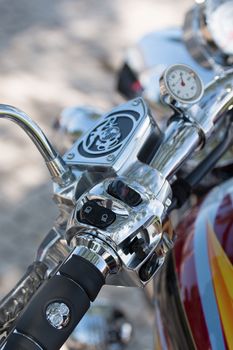 Close view detail of the shiny details of a classic motorcycle.