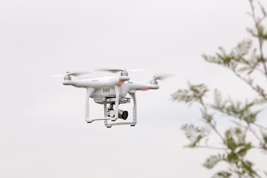 View of a small consumer quadrocopter drone in flight.