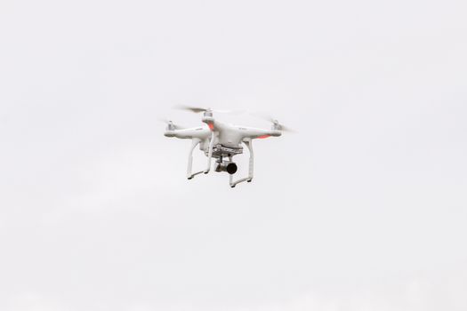 View of a small consumer quadrocopter drone in flight.