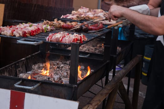 Close view of grilling meat in coal.