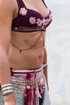 Detail view of the dress of belly dancer girl.