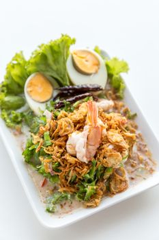 winged bean salad with shrimp and boiled egg on white background