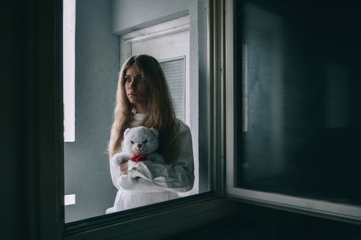 mentally ill girlwith a straitjacket in a Psychiatric