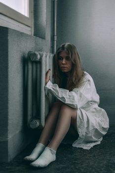 mentally ill girlwith a straitjacket in a Psychiatric