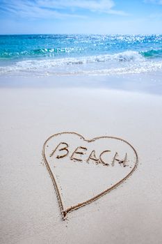 Free text on white sandy beach and sea
