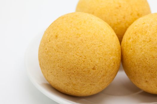 Traditional Colombian buñuelos (Deep Fried Cheese Bread) isolated on white background