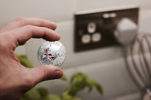 Physical metal brexit coin with map of england. Brexit concept. Europe leaving.