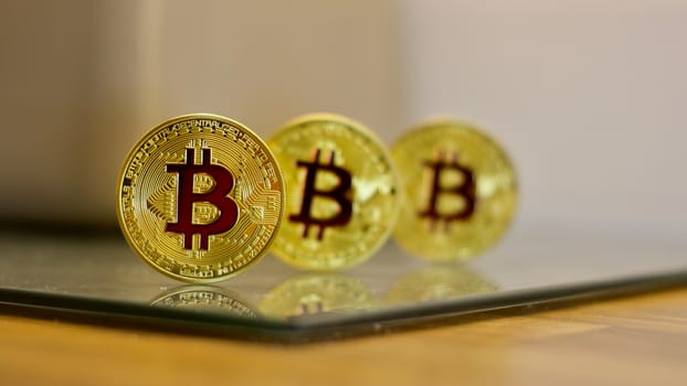 Digital currency physical metal bitcoin coin. Cryptocurrency cash concept.