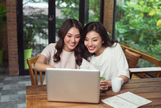 Two asian woman using laptop for shopping online with credit card payment