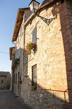 a alley with a old stone housesa 