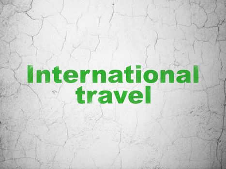 Travel concept: Green International Travel on textured concrete wall background