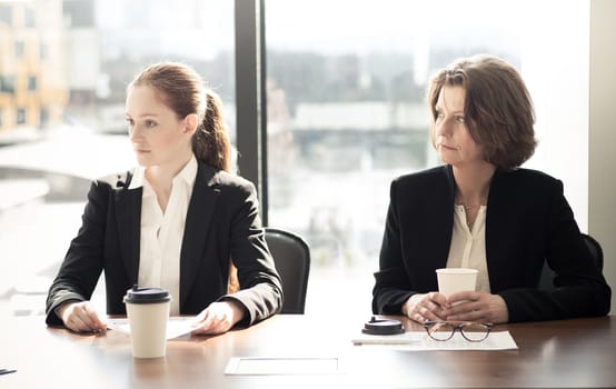 Image of business partners discussing documents and ideas at meeting