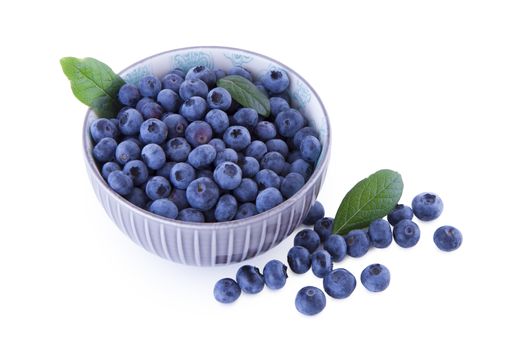 Blueberries in a bowl, fruits isolated on white background