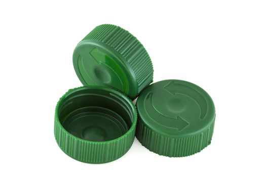 Three green plastic bottle caps isolated on white nackground