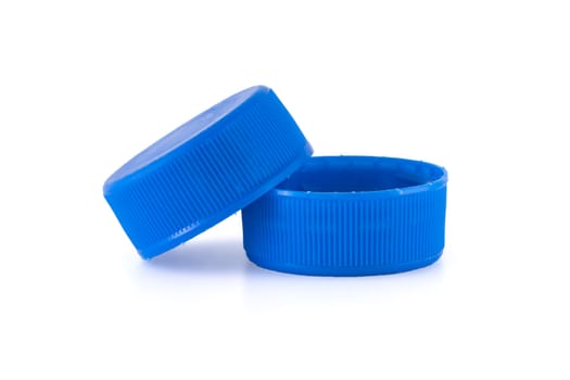 Two blue plastic bottle caps isolated on white