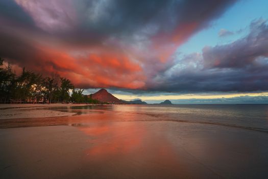 Amazng sunset in "flic and flac" beach at Mauritius Island with awesome red/orange cloud.