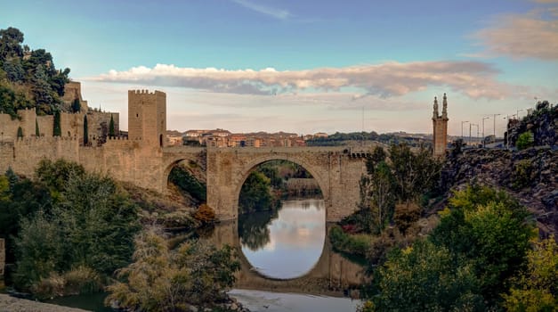 View to Alcantara bridge with reflection, Toledo, Spain