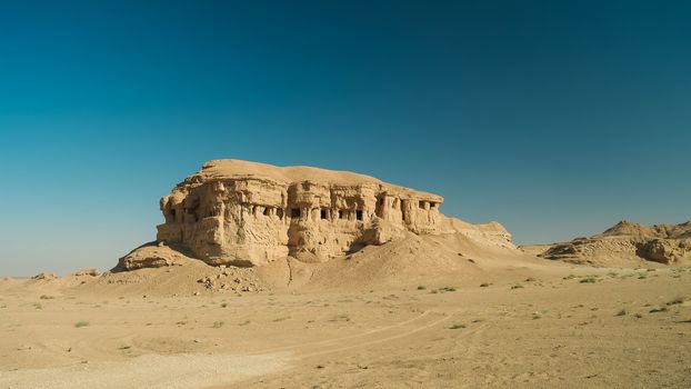 Butte at the dried shore of Razazza lake aka Milh lake or Sea of Salt, Iraq