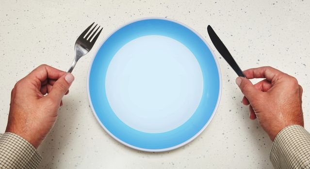 tableware in hands of man and plate