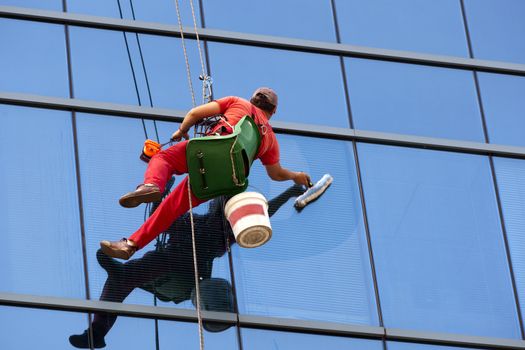 Worker clean the glass