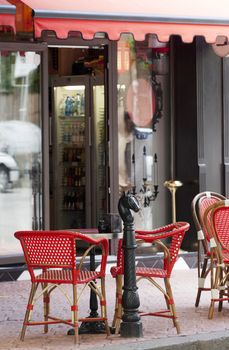 French style cafe with red shelter.