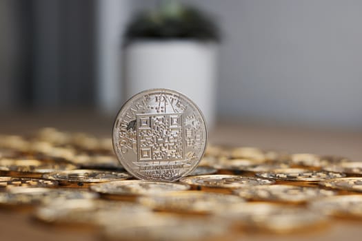 Digital currency physical metal bitcoin coin on the gold money background. Money concept.