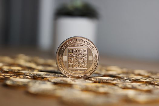 Digital currency physical metal bitcoin coin on the gold money background. Money concept.