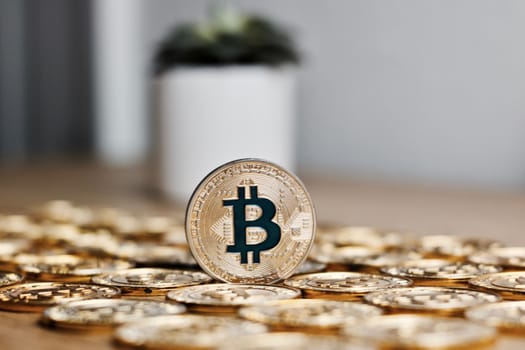 Digital currency physical metal bitcoin coin on the gold money background. Money concept.