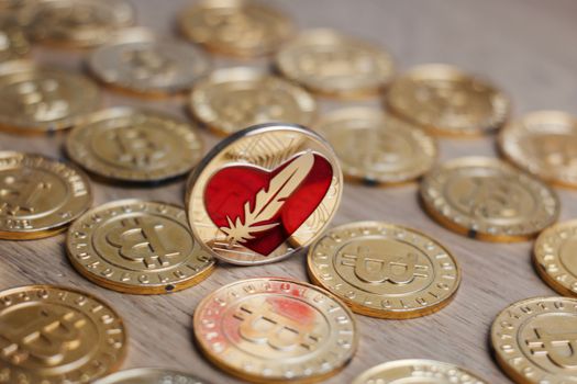 Digital currency physical metal bitcoin coin on the gold money background. Money concept.