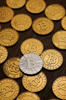 Digital currency physical metal bitcoin coin on the gold money background. Money concept.