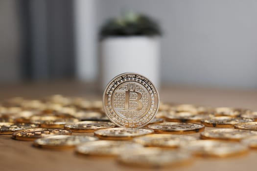 Digital currency physical metal bitcoin coin on the gold money background. Money concept.