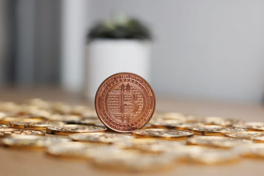 Digital currency physical metal bitcoin coin on the gold money background. Money concept.