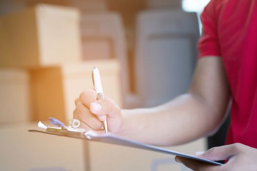 parcel delivery man Counting Check stock Prepare to send the package to the customer. Validate every time in transportation. In order not to make mistakes in the work.