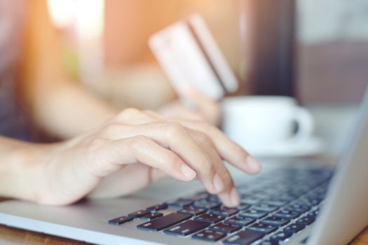 Women use credit cards to shop online.