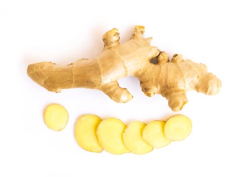 Fresh ginger root with slices on white background for herb and medical product concept, top view