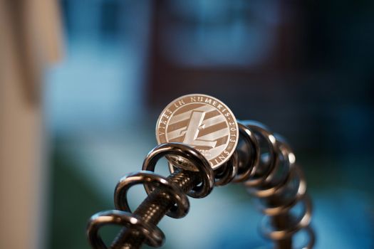Digital currency physical metal litecoin coin. Cryptocurrency miningn concept.