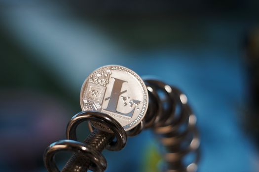 Digital currency physical metal litecoin coin. Cryptocurrency miningn concept.