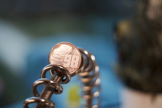 Digital currency physical brass dogecoin coin. Cryptocurrency mining concept.