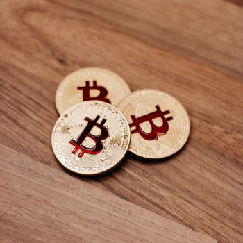 Digital currency physical metal bitcoin coin. Cryptocurrency cash concept.