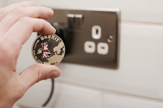 Physical metal brexit coin with map of england. Brexit concept. Europe leaving.