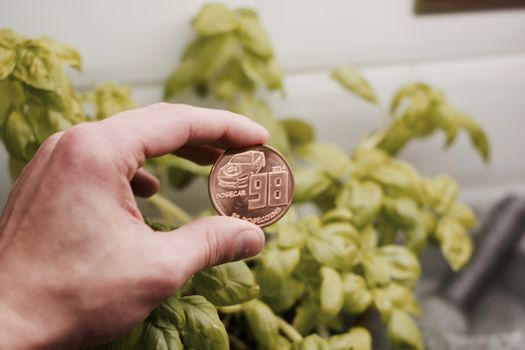 Digital currency physical brass dogecoin coin. Cryptocurrency mining concept.