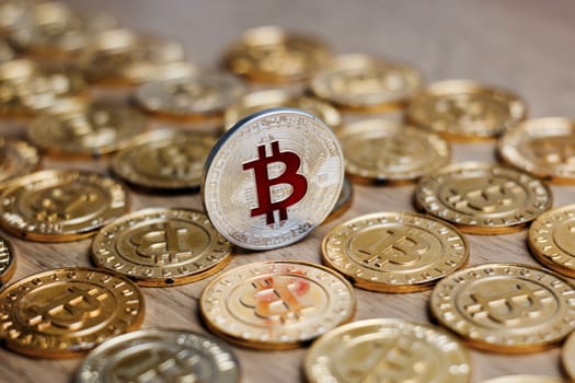 Digital currency physical metal bitcoin coin on the gold money background. Money concept.
