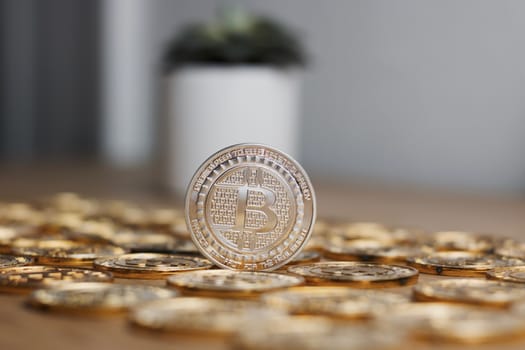 Digital currency physical metal bitcoin coin on the gold money background. Money concept.